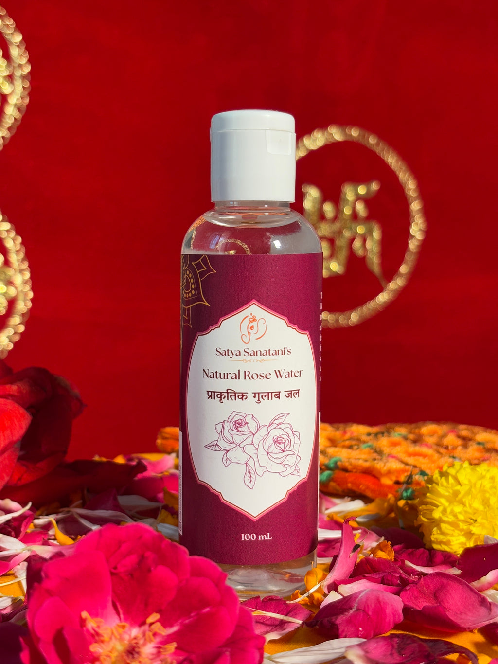 100ml rose water bottle placed on devotional altar with petals