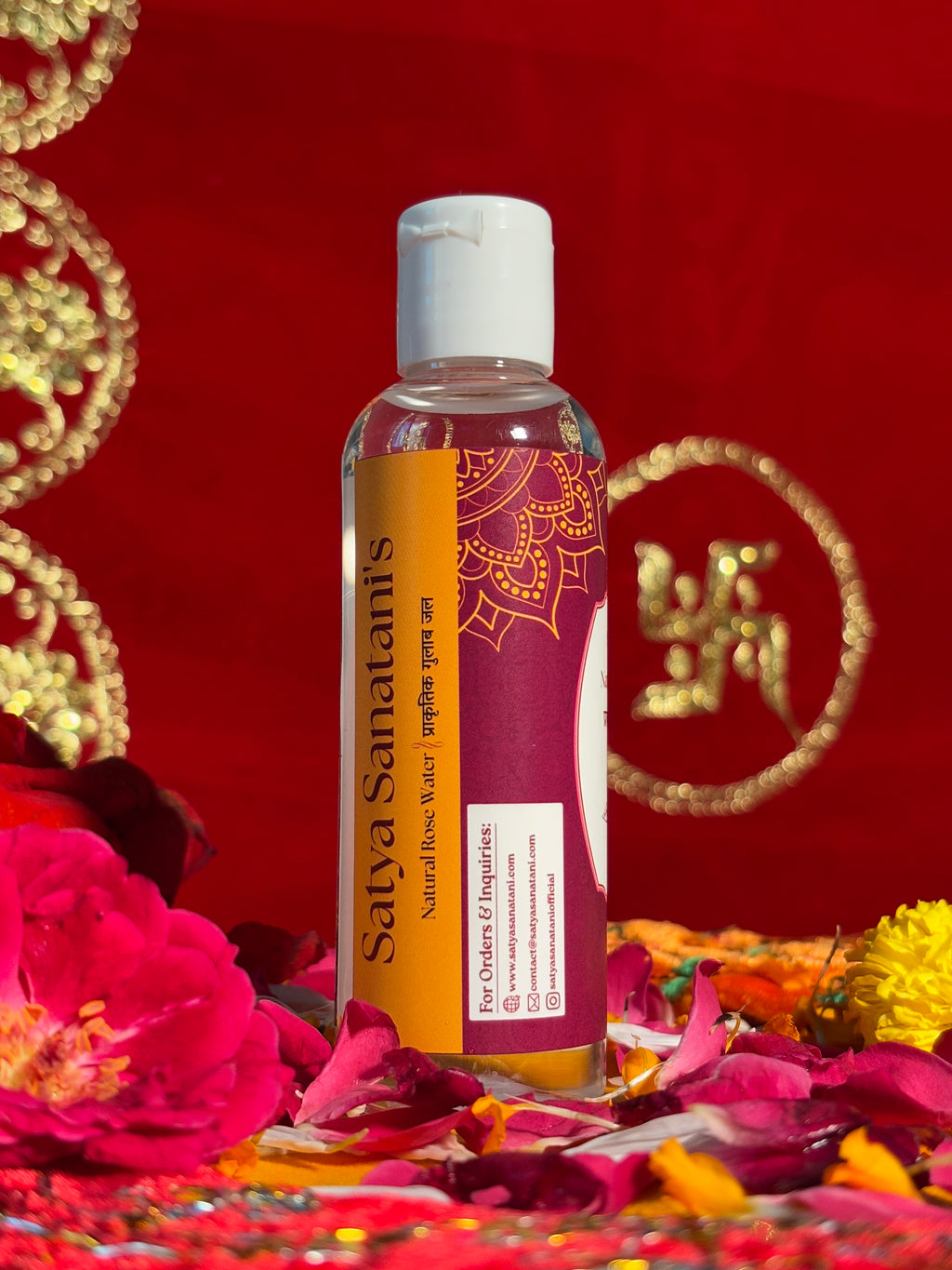 Side view of Satya Sanatani Rose Water bottle, puja background