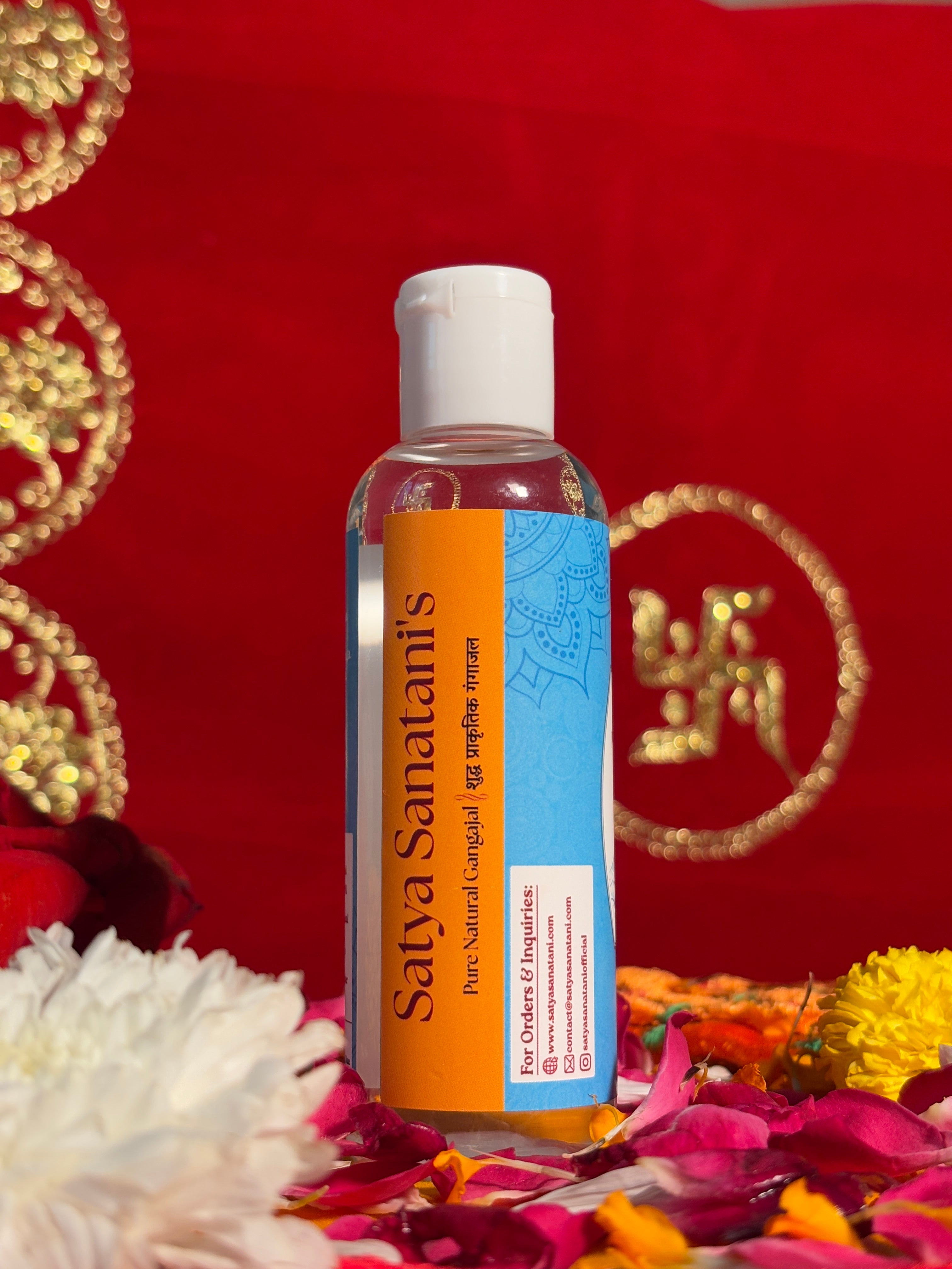 Gangajal bottle displayed with flowers for puja and rituals