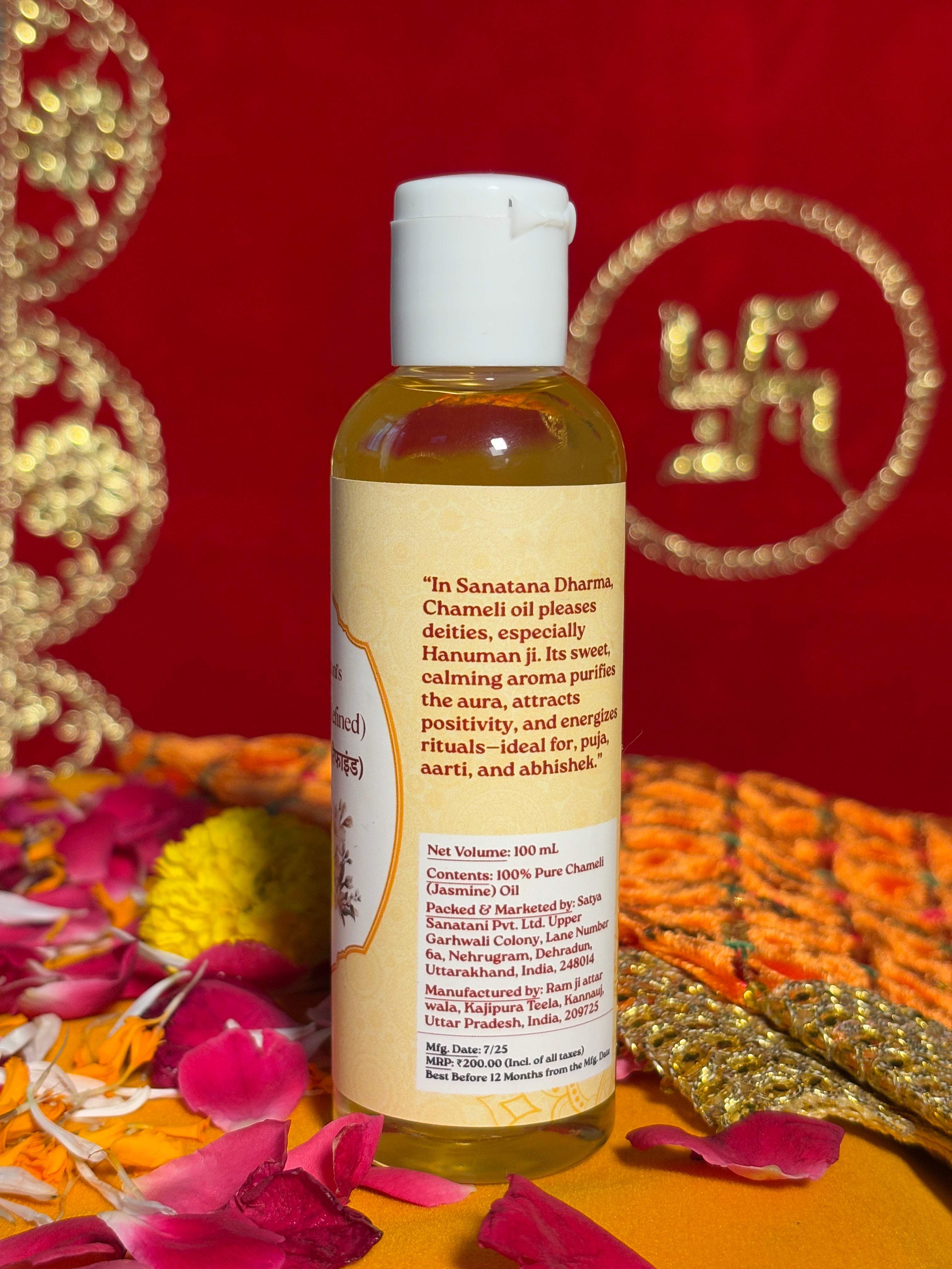 Side view of Jasmine Oil bottle with sacred background and petals