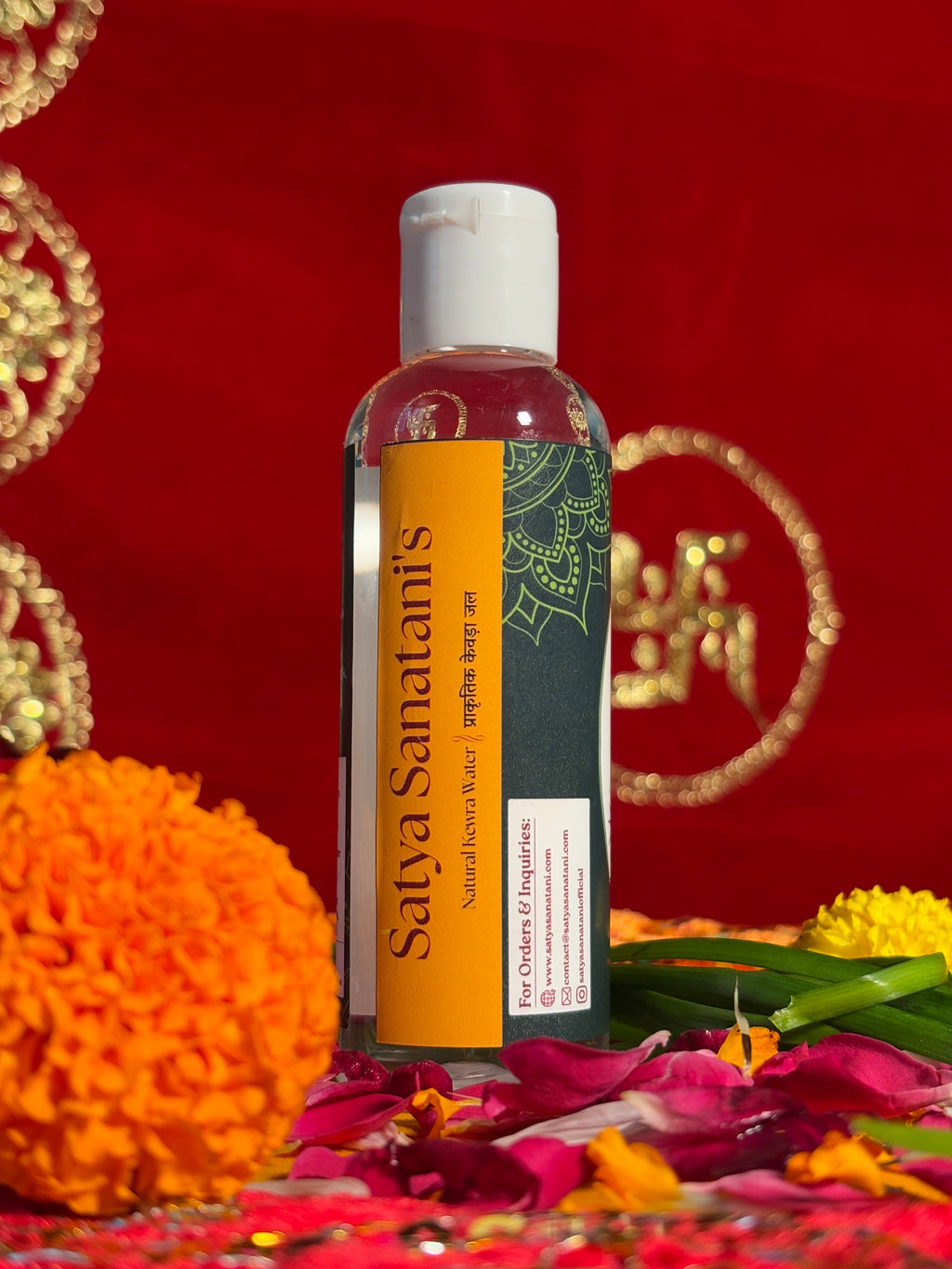 Pure Kewra Water bottle displayed with flowers for temple rituals