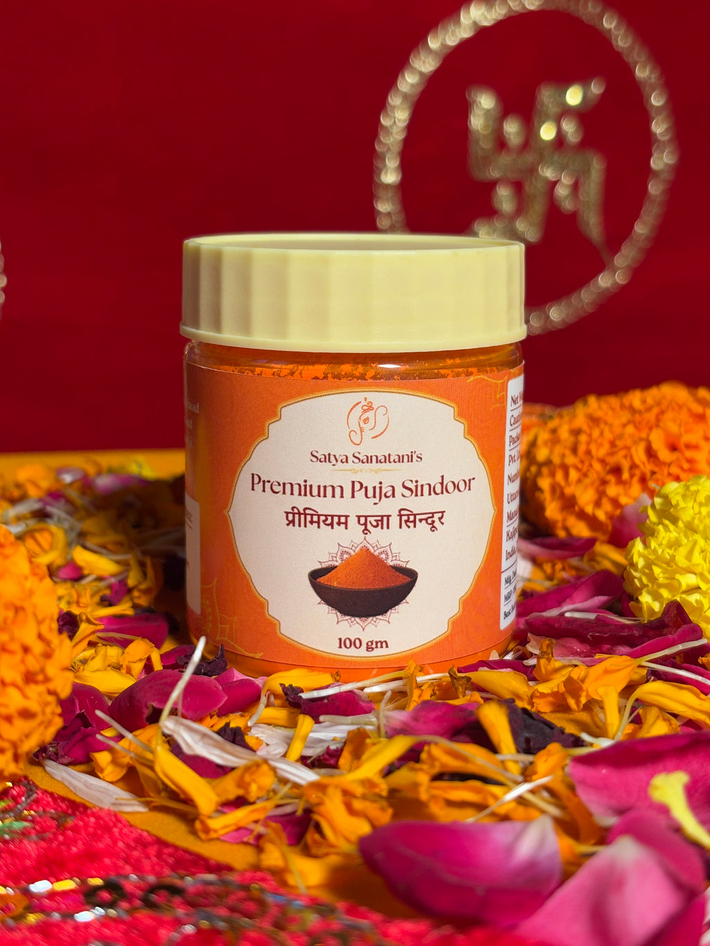 Premium devotional Sindoor container front view with Swastik backdrop