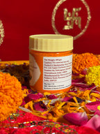 Side view of Puja Sindoor jar with saffron-red background