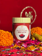 100gm devotional Roli jar with Swastik backdrop, front view