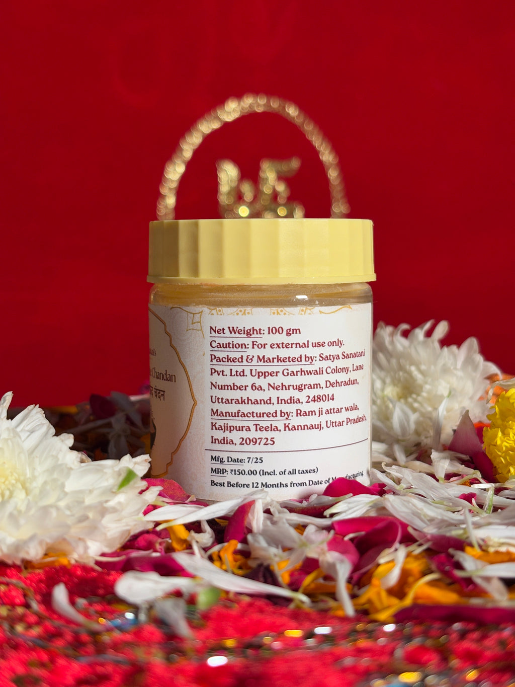 Side view of White Chandan devotional jar with saffron-red background