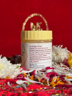 Side view of White Chandan devotional jar with saffron-red background