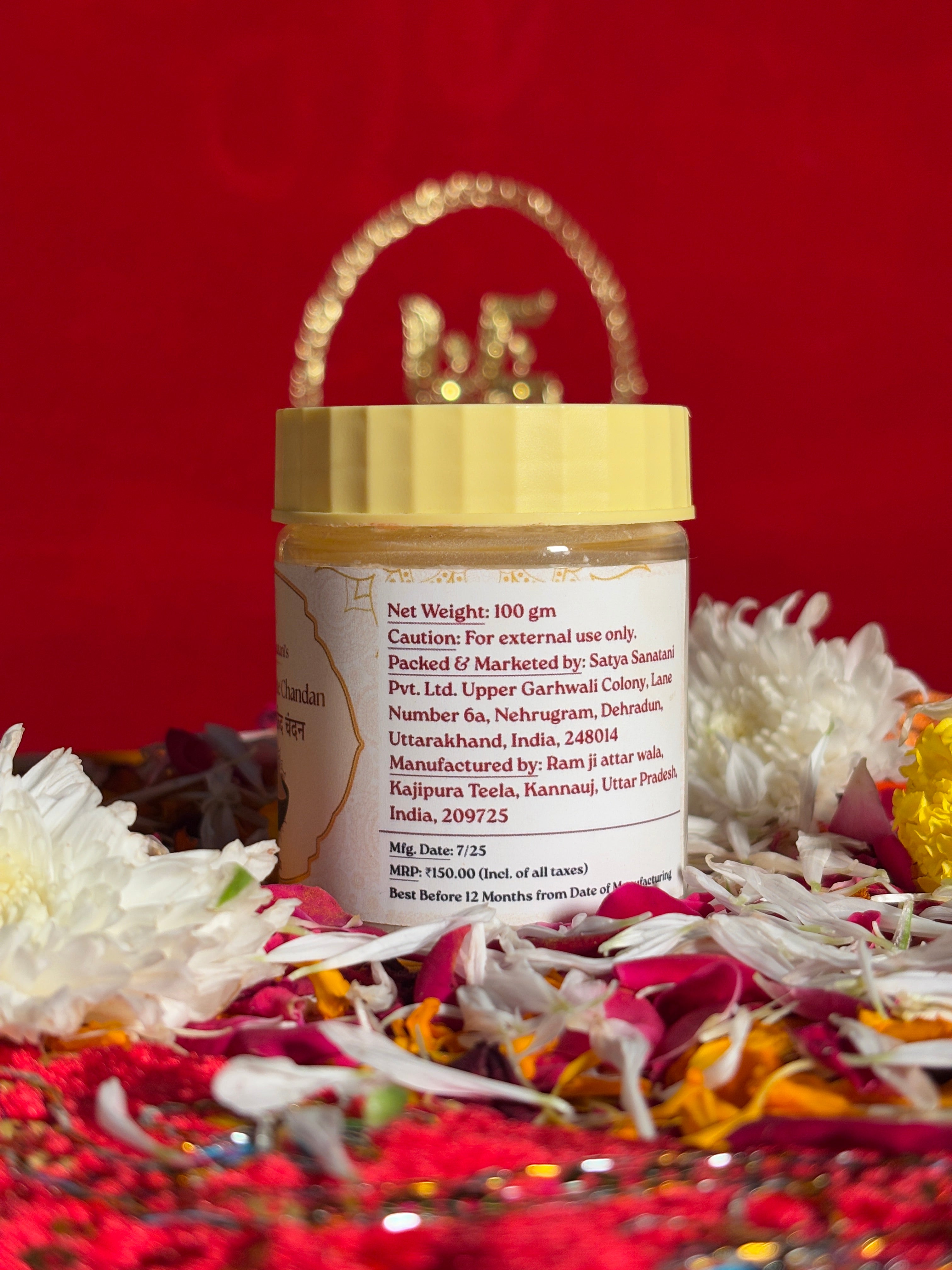 Side view of White Chandan devotional jar with saffron-red background