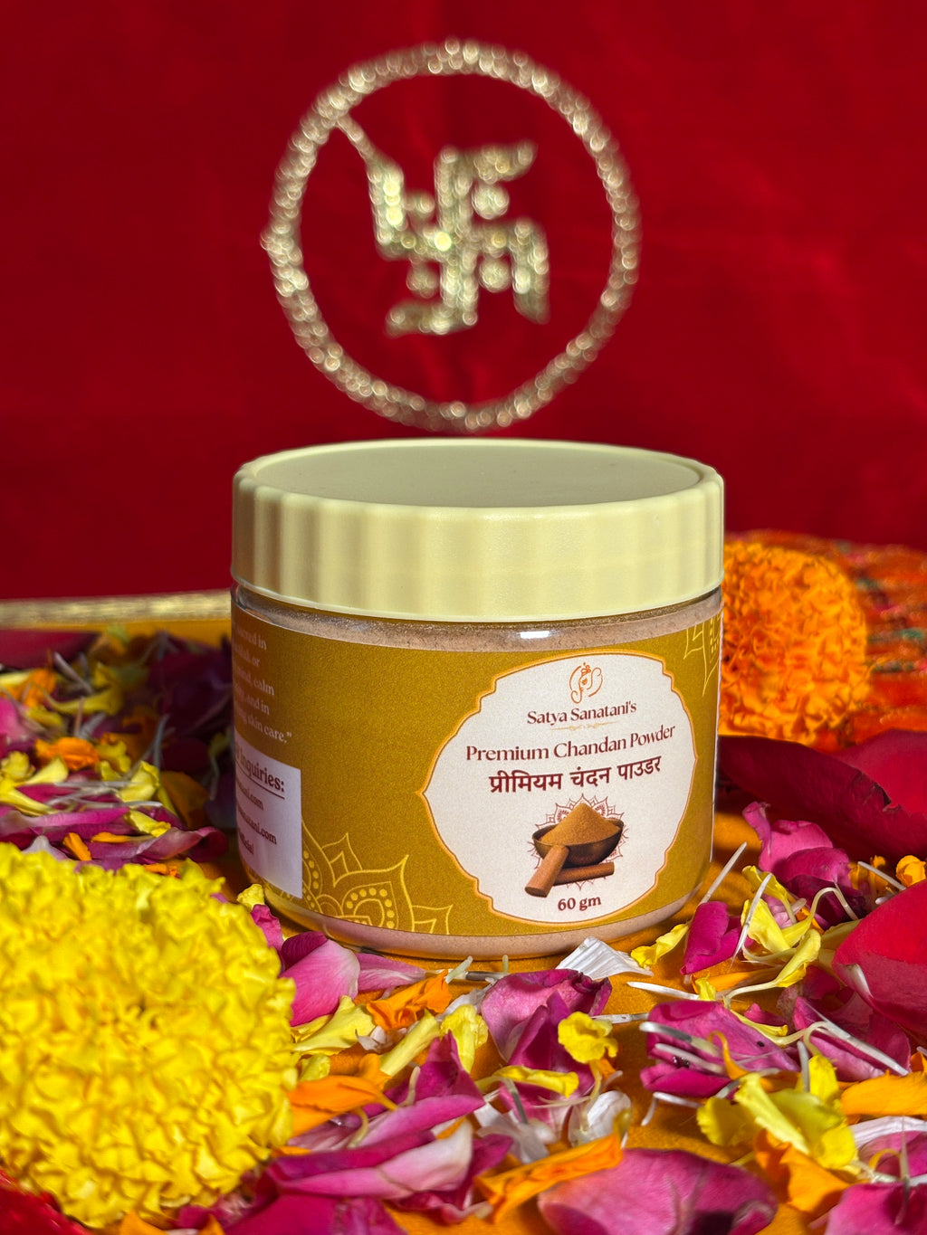 Satya Sanatani Chandan Powder 60gm jar with puja flowers and Swastik backdrop