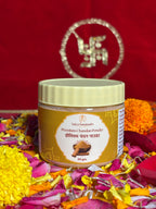 Premium devotional Chandan container front view with saffron background