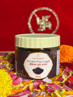 Premium devotional Guggal container front view with saffron backdrop