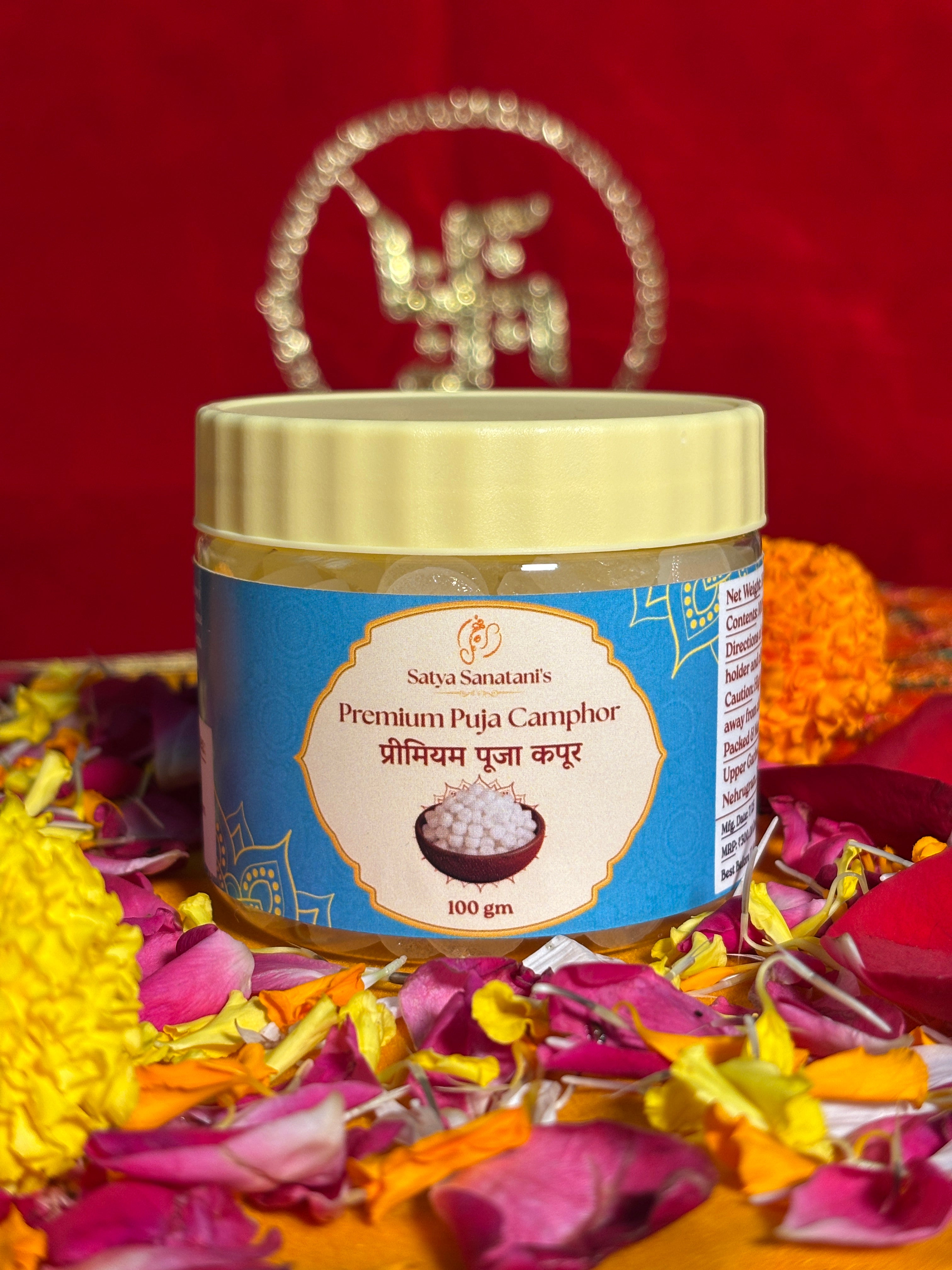 Premium devotional camphor container front view with saffron backdrop