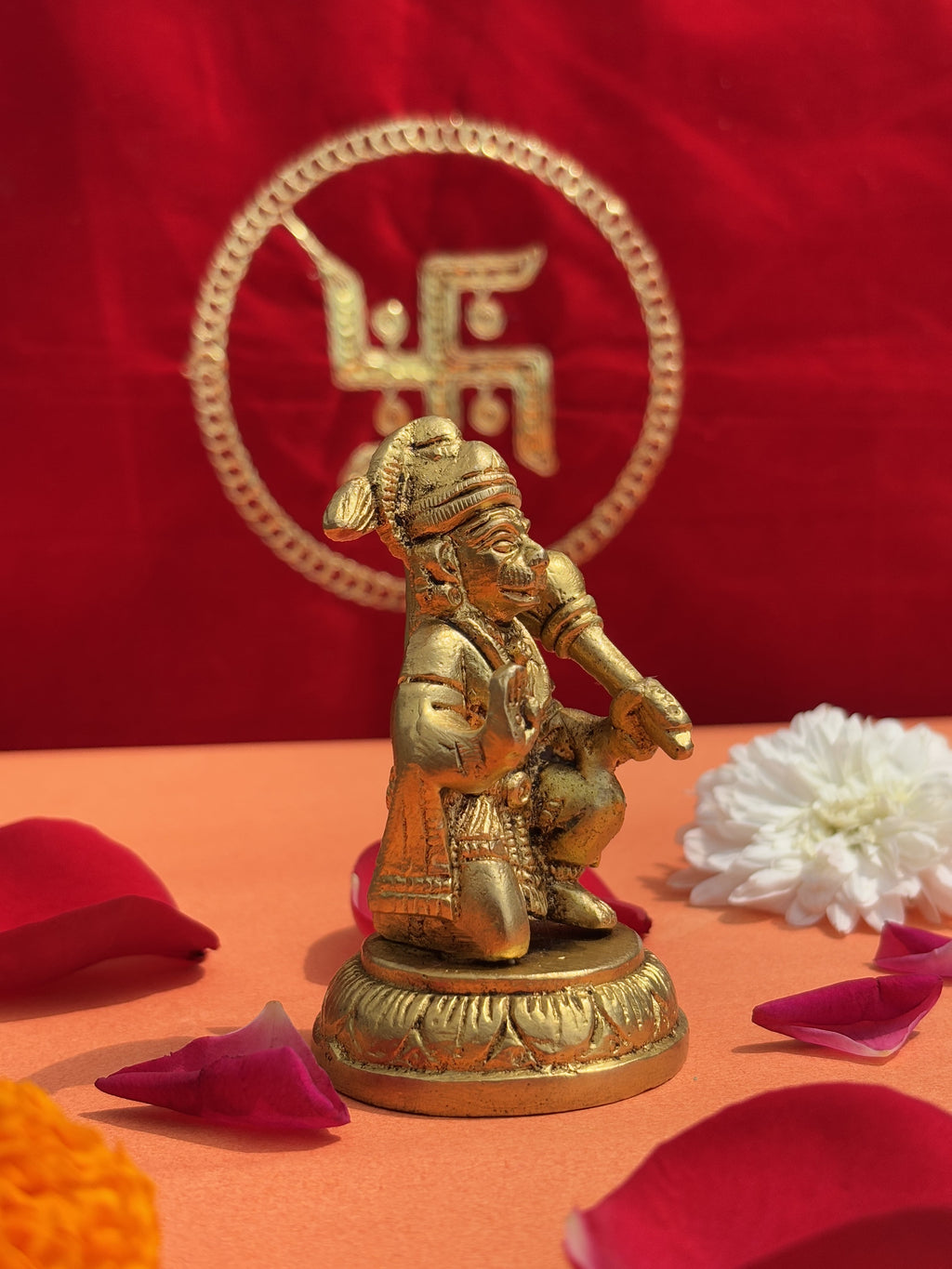 6-inch antique golden Hanuman Ji murti side view with puja flowers