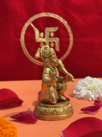 6-inch antique golden Hanuman Ji murti side view with puja flowers