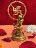Sankat Mochan brass idol with marigold and rose petals