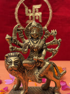 Brass idol of Maa Durga slaying Mahishasura, detailed ornaments and lion figure