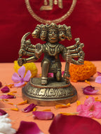 Full view of Panchmukhi Hanuman Brass Statue with detailed carving and puja flowers